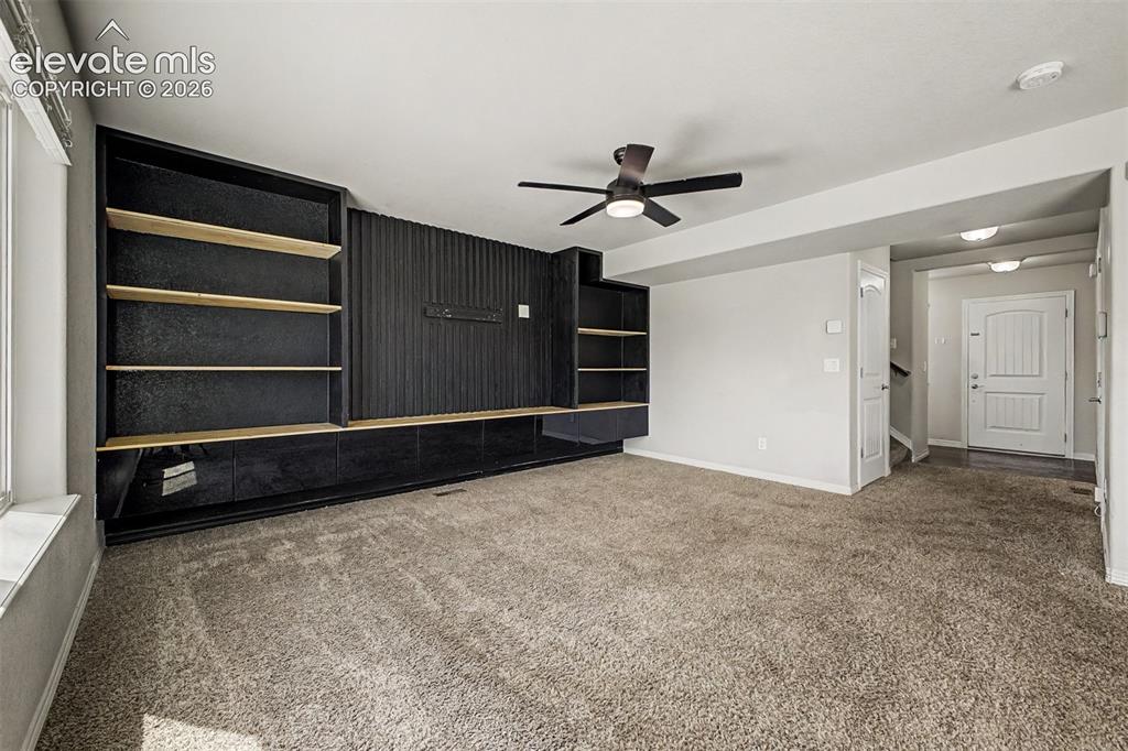 Image 18 of 39: Custom Wall feature with built in cabinets
