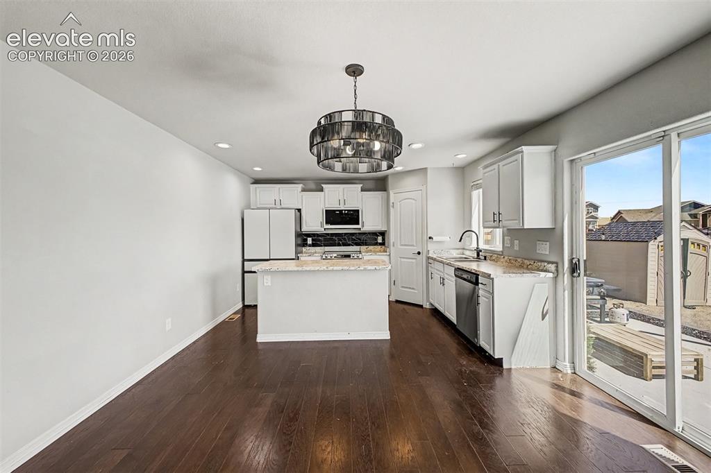Image 3 of 39: Kitchen and Dining Laminate flooring