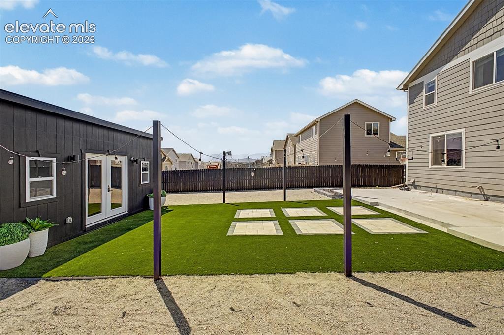 Image 7 of 39: Professionally Landscaped Backyard