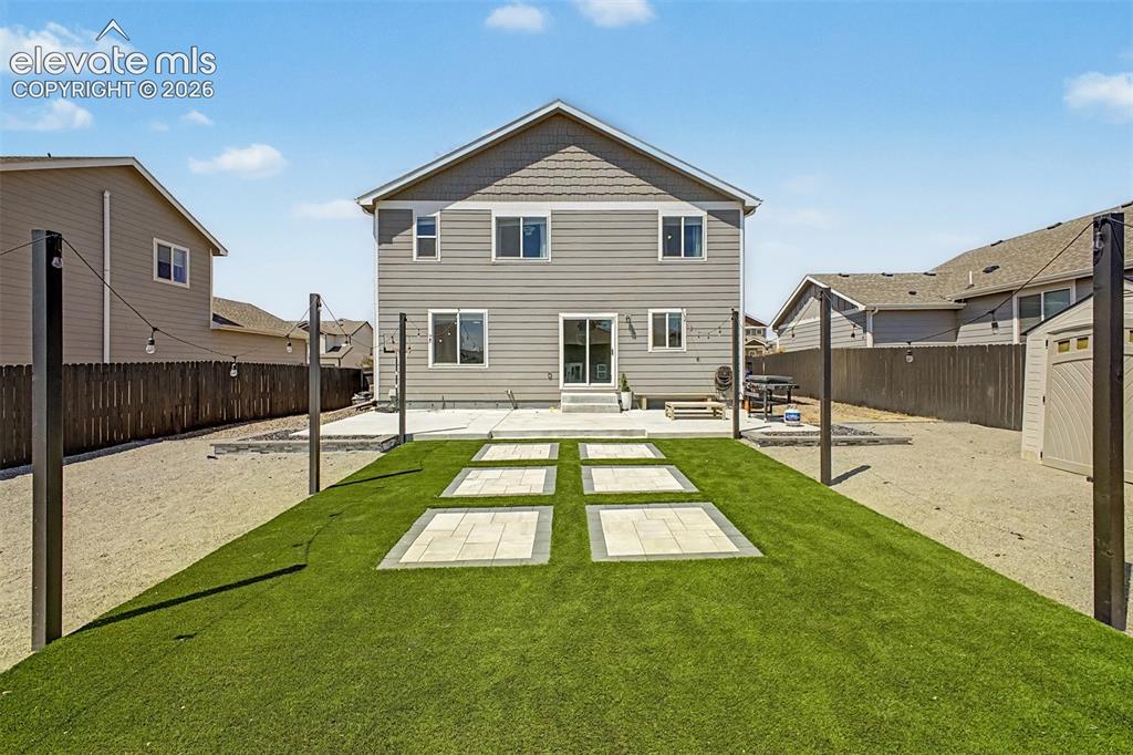 Image 8 of 39: Professionally Landscaped Backyard