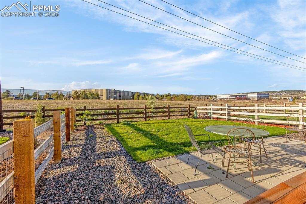 Image 27 of 38: View of yard featuring a patio and a view of rural / pastoral area