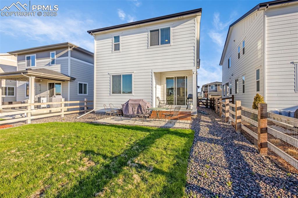 Image 29 of 38: Rear view of house featuring a patio