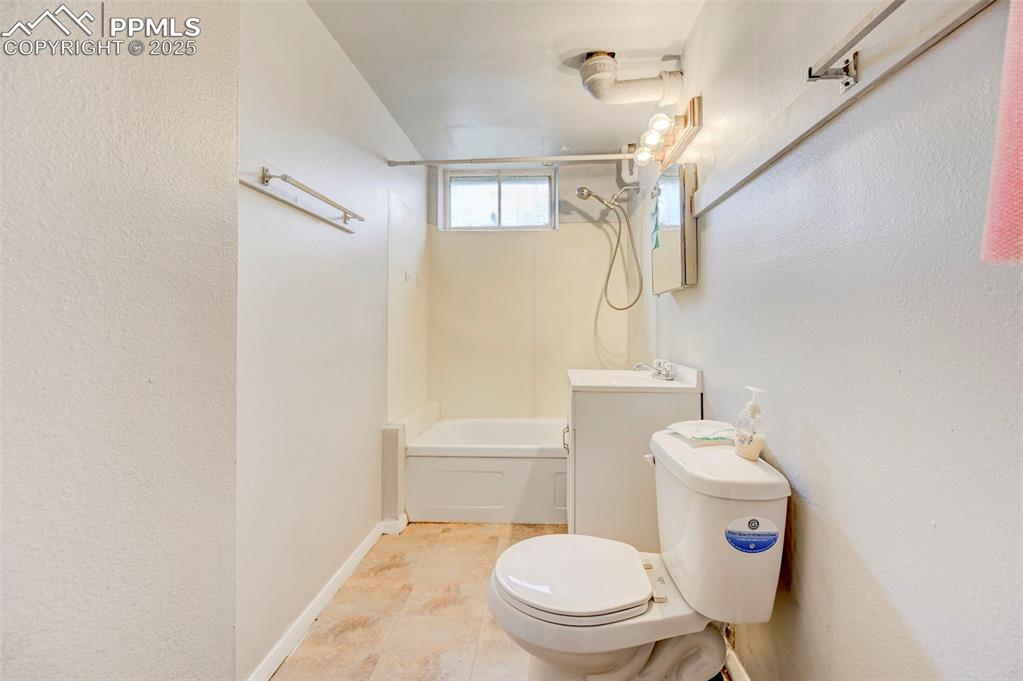 Image 22 of 30: Basement bathroom with jet tub