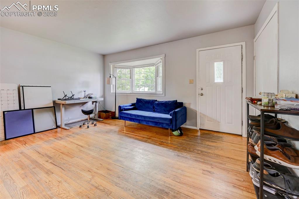 Image 4 of 30: Entry- into the living room, with hardwood floors