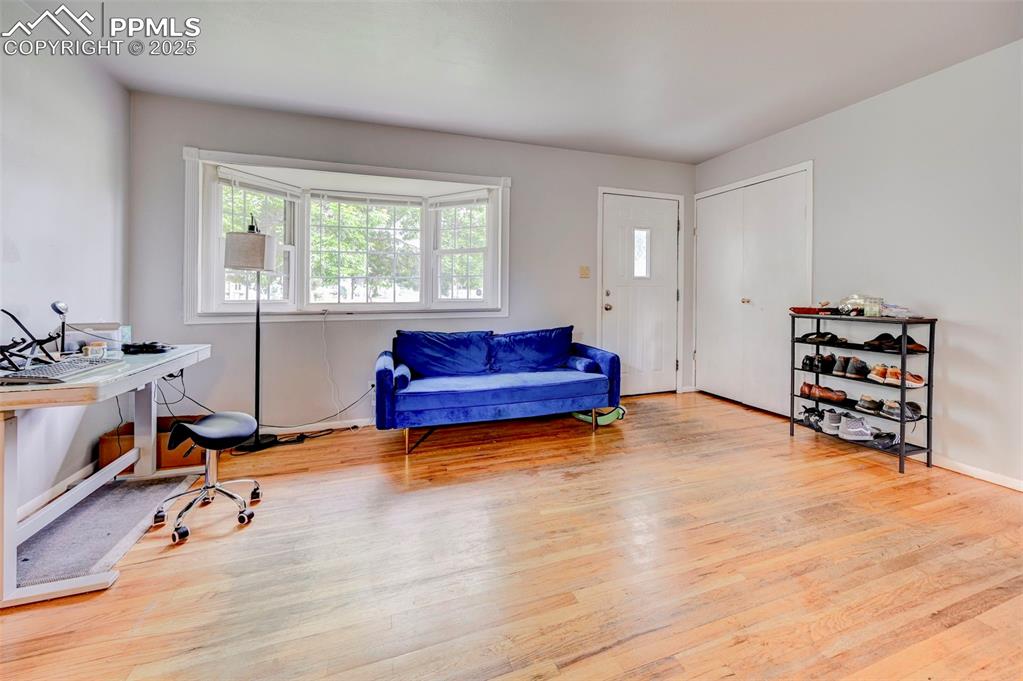Image 5 of 30: Living room with hardwood floors