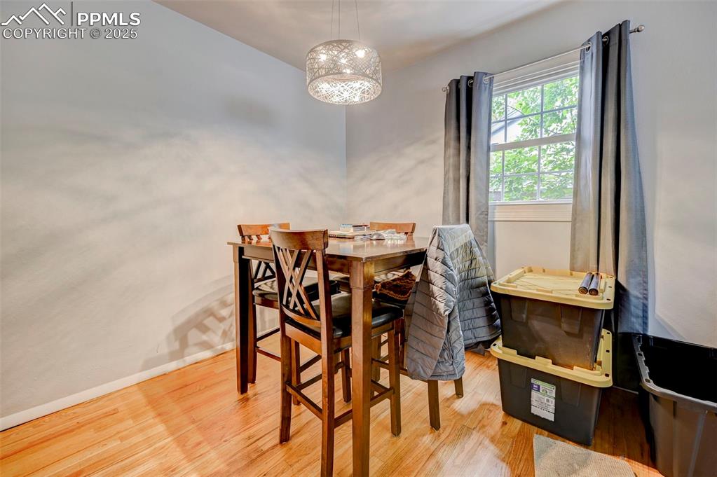 Image 6 of 30: Dining room with hardwood floors