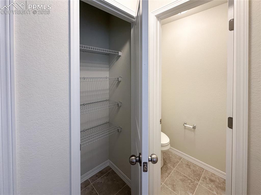 Image 24 of 46: Primary bath linen closet
