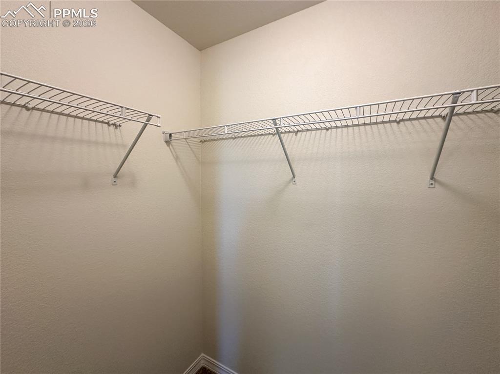 Image 32 of 46: Secondary walk in closet