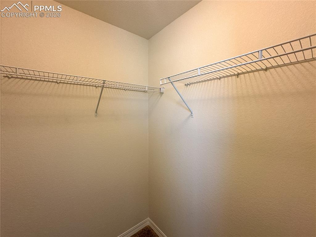 Image 37 of 46: Secondary walk in closet