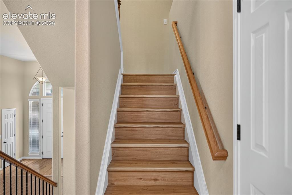 Image 23 of 43: Staircase with new LVP treads,