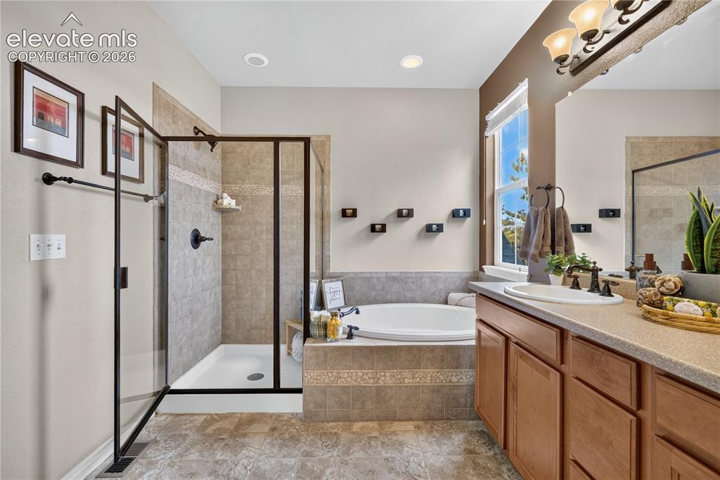 Image 5 of 43: 5 piece master with generous soaking tub, separate shower, double vanity, a