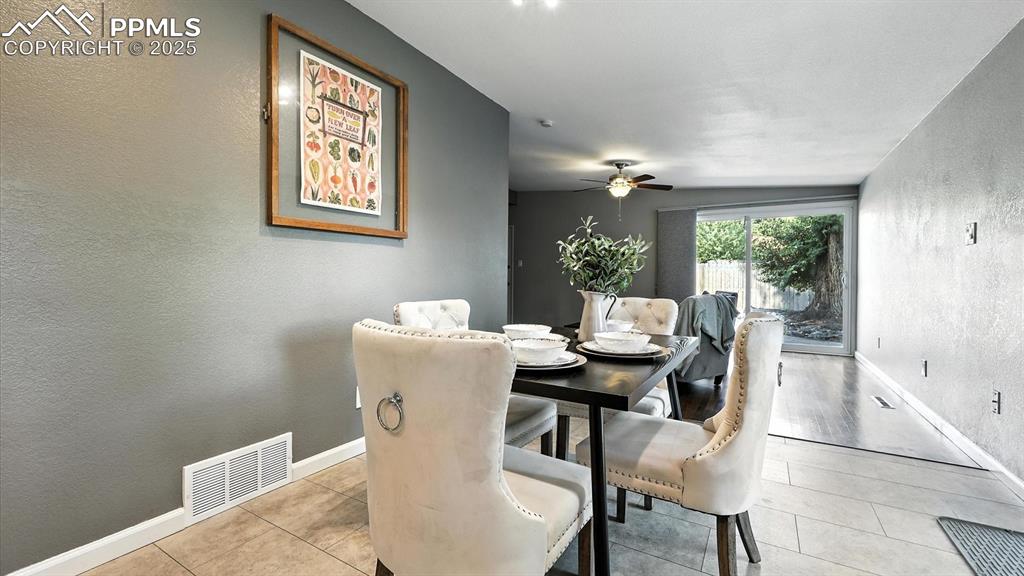 Image 13 of 35: View of the Dining Area and slider out to the backyard patio from the Livin