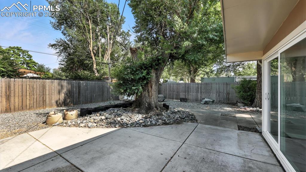 Image 15 of 35: Backyard patio, great for BBQs, entertaining, and lots of family fun.