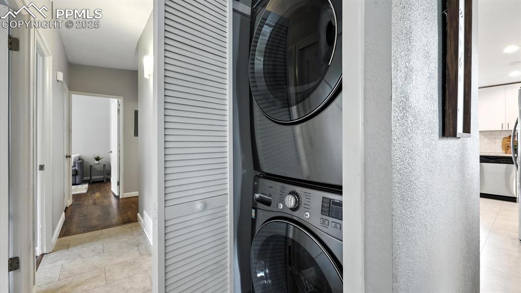 Image 22 of 35: Laundry Nook with stackable washer and dryer.