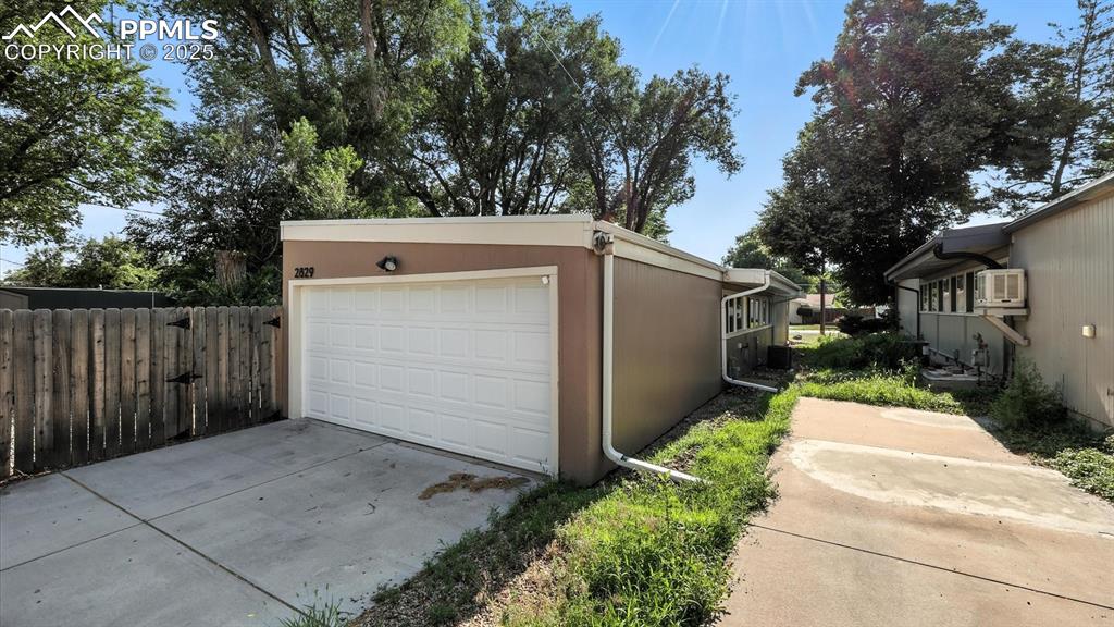 Image 35 of 35: 2-car attached garage with access from the paved alley.