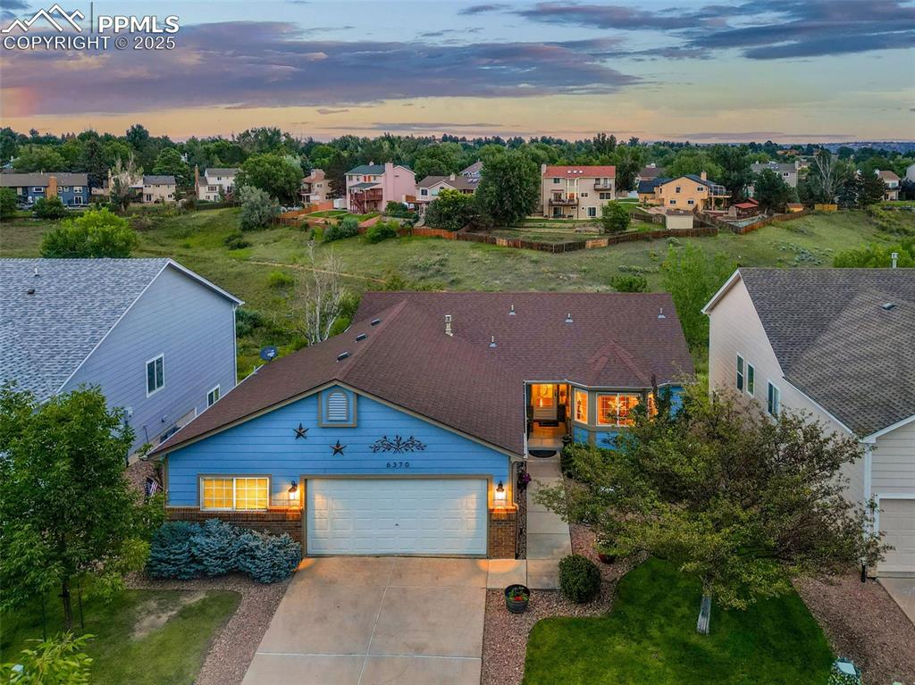 Caption: Aerial view at dusk of a residential view