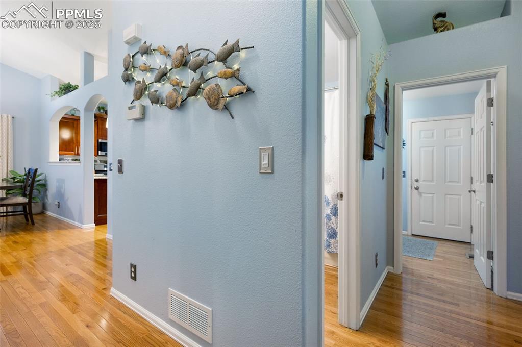 Image 14 of 49: Hallway with light wood-style flooring