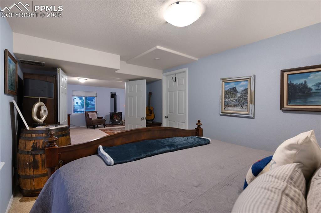 Image 35 of 49: Carpeted bedroom