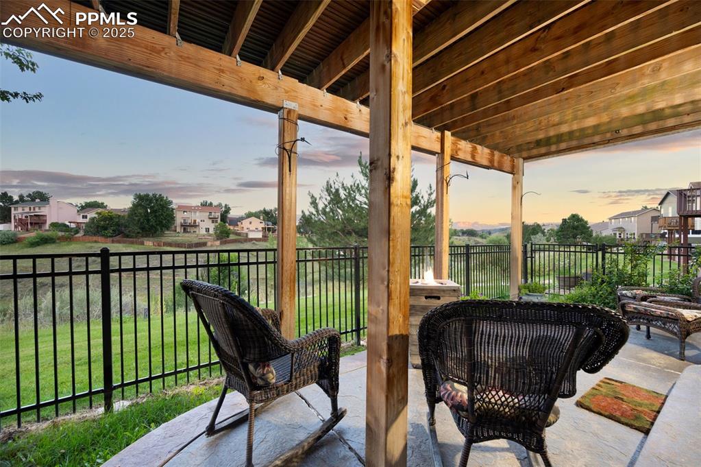 Image 39 of 49: Patio terrace at dusk featuring a patio area