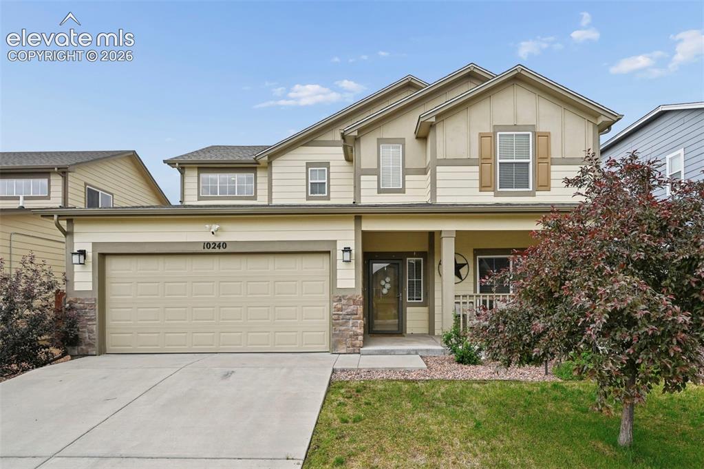 Image 1 of 24: Two-story home featuring a combination of siding and stone veneer accents