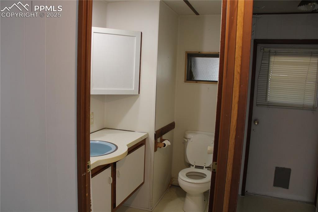Image 12 of 20: Bathroom with vanity and toilet