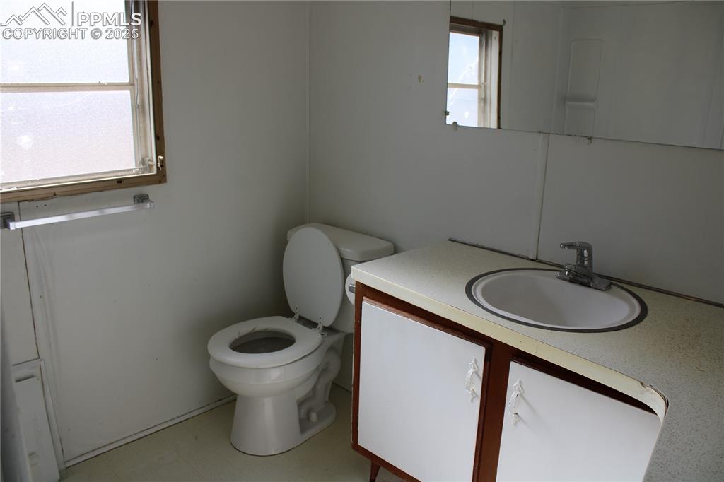 Image 17 of 20: Full bath featuring vanity and light flooring