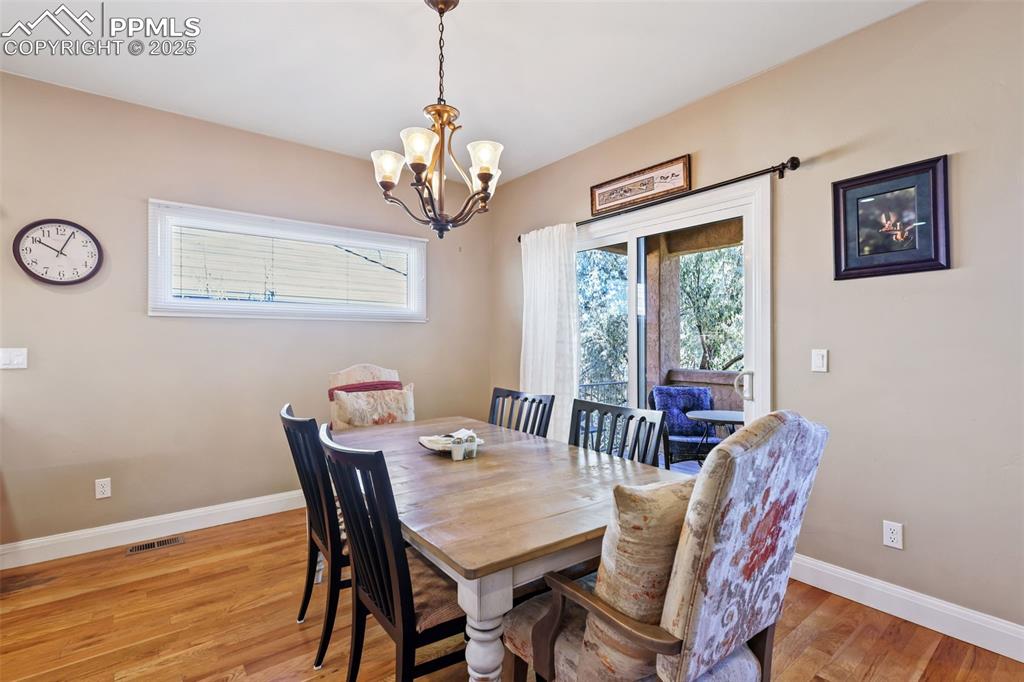 Image 13 of 37: Dining area with hardwood floors