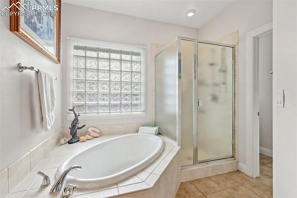 Image 18 of 37: Tub and separate shower