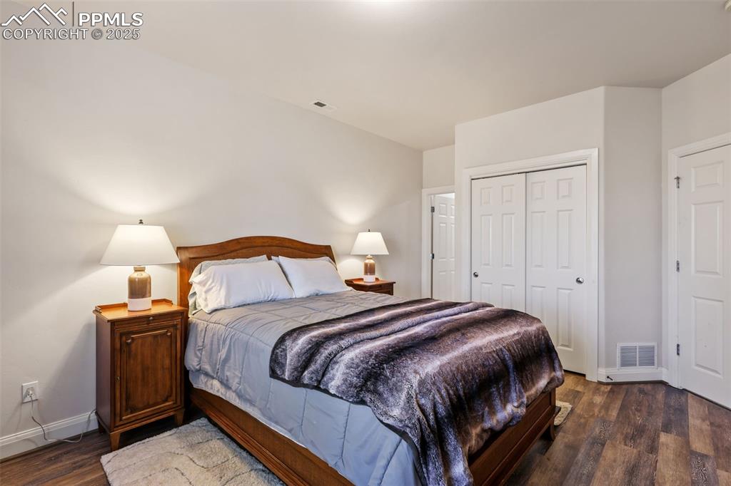 Image 28 of 37: Basement bedroom with adjoining bath
