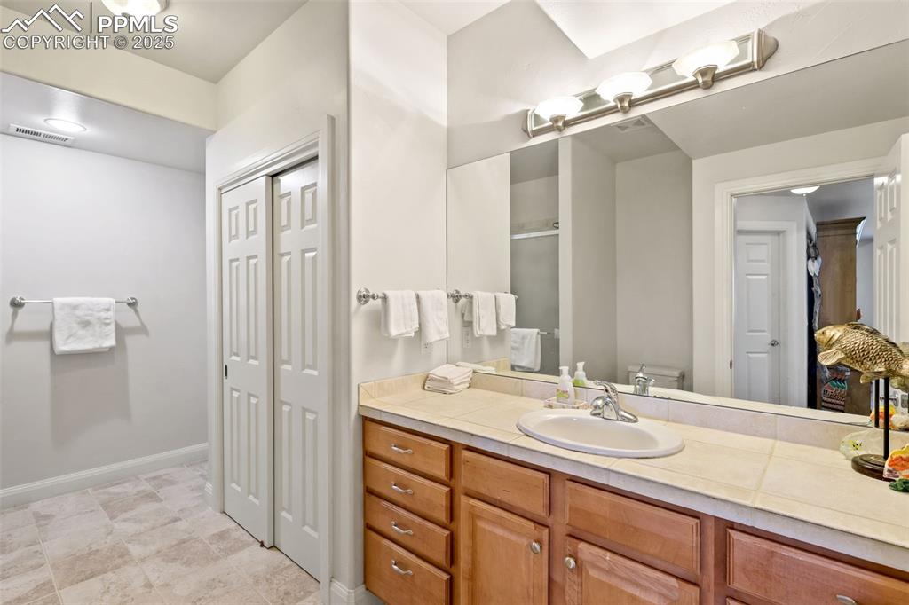 Image 30 of 37: Basement bath has space for a stackable washer/dryer