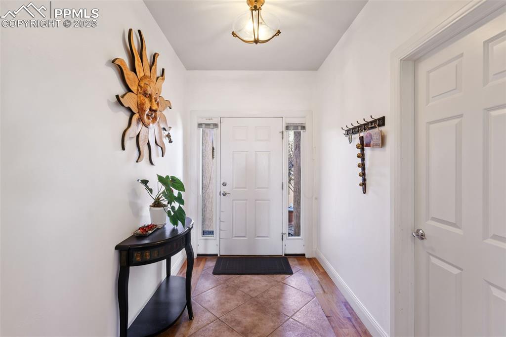 Image 4 of 37: Wood floors with tile inlay
