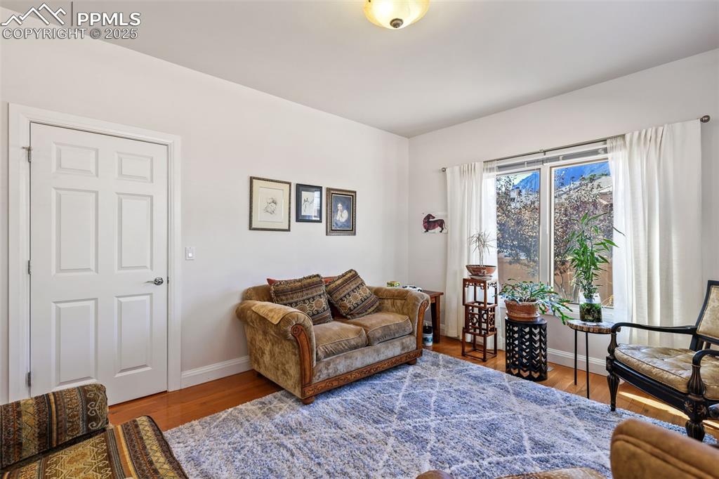 Image 7 of 37: Front study/reading room with hardwood floors