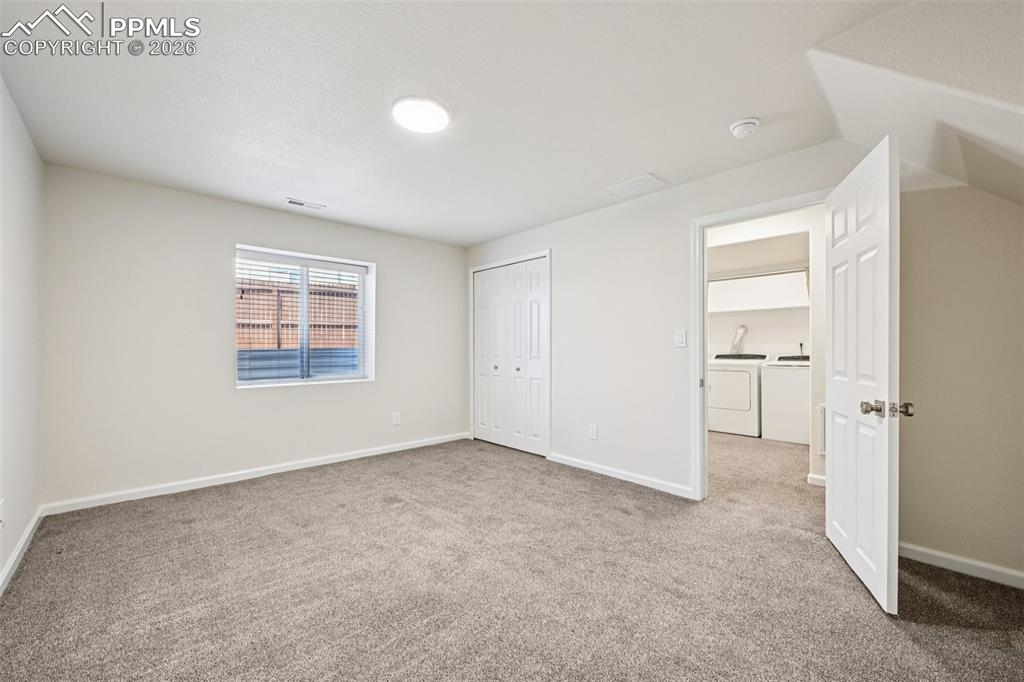 Image 32 of 39: Basement Bedroom