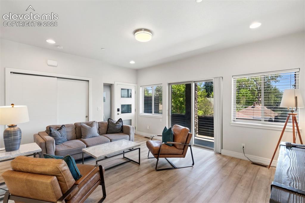 Image 2 of 43: Living room with walkout access to deck