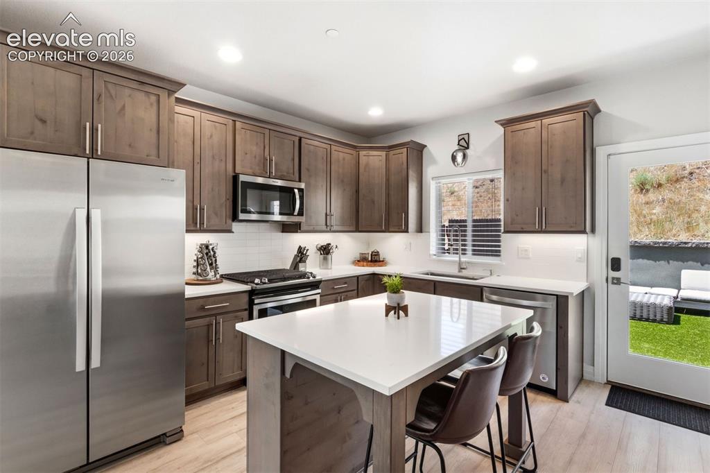 Image 3 of 43: Kitchen with Quart counters