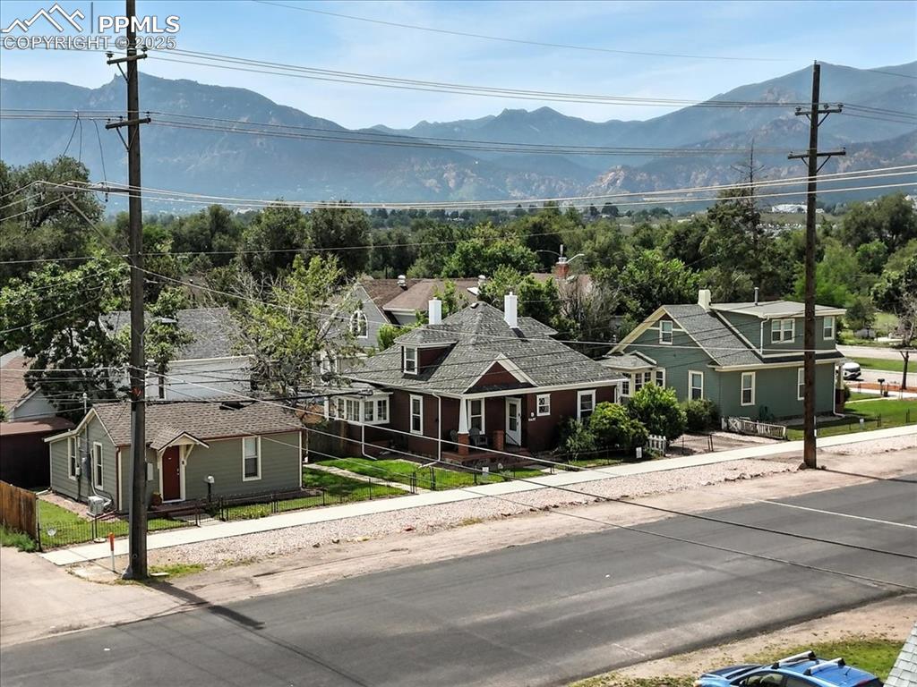 Caption: View of mountain backdrop featuring nearby suburban area