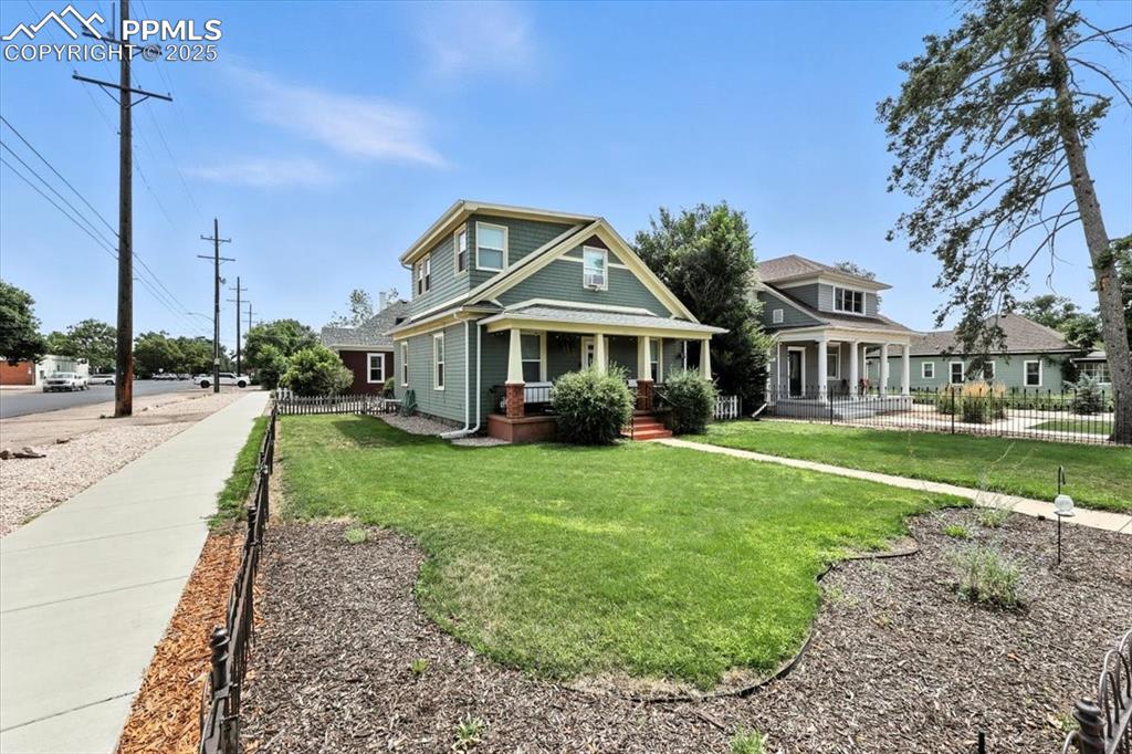 Image 2 of 48: View of front of property featuring covered porch