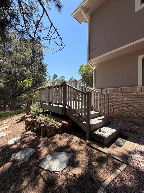 Image 46 of 46: Steps to Lower Level of Deck