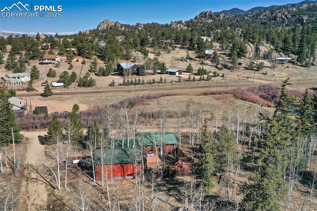 Image 28 of 38: Birds eye view of property featuring a mountain view