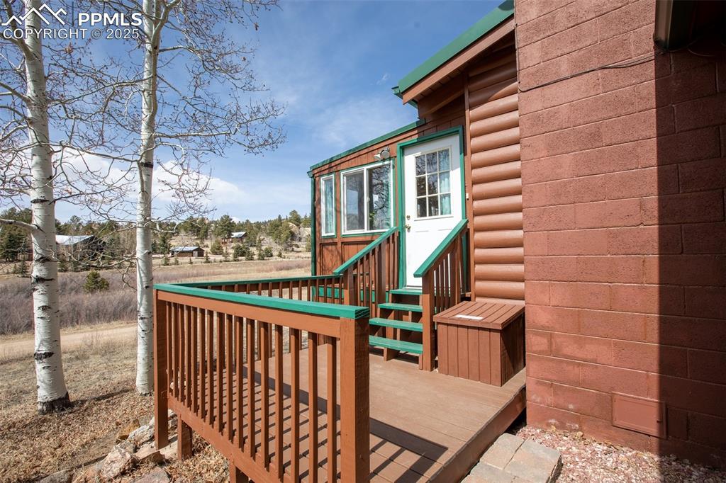 Image 3 of 38: Wooden deck featuring entry steps