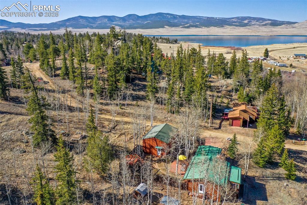 Image 31 of 38: Birds eye view of property featuring a water and mountain view