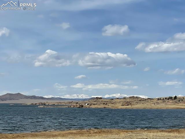Image 37 of 38: Snow Capped Mountains in the distance
