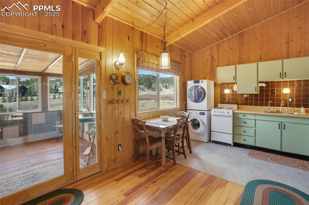 Image 9 of 38: Dining space with light wood-type flooring, a healthy amount of sunlight, s