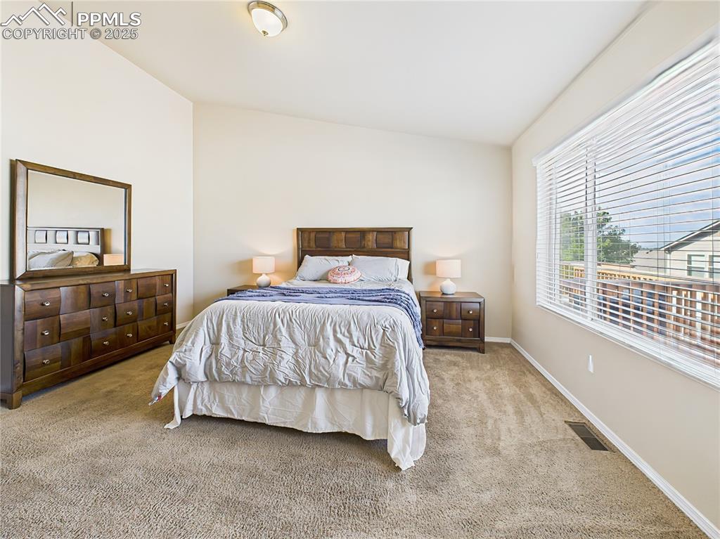 Image 17 of 50: Generous space with neutral tones and direct access to a walk-in closet and