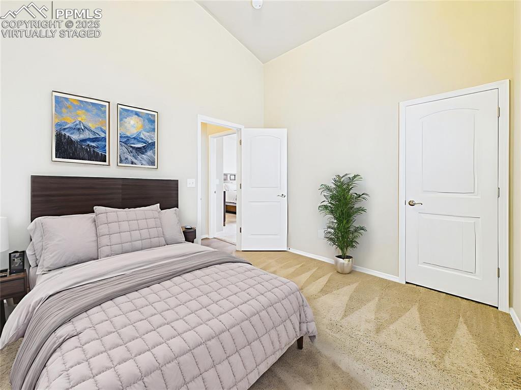 Image 24 of 50: Virtually Staged – Shown with furniture to highlight space for a queen bed 