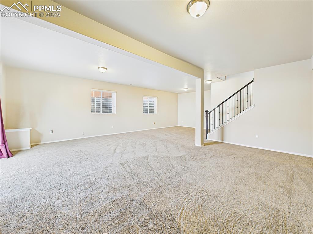 Image 29 of 50: Open lower-level living with endless possibilities for a home theater, fitn