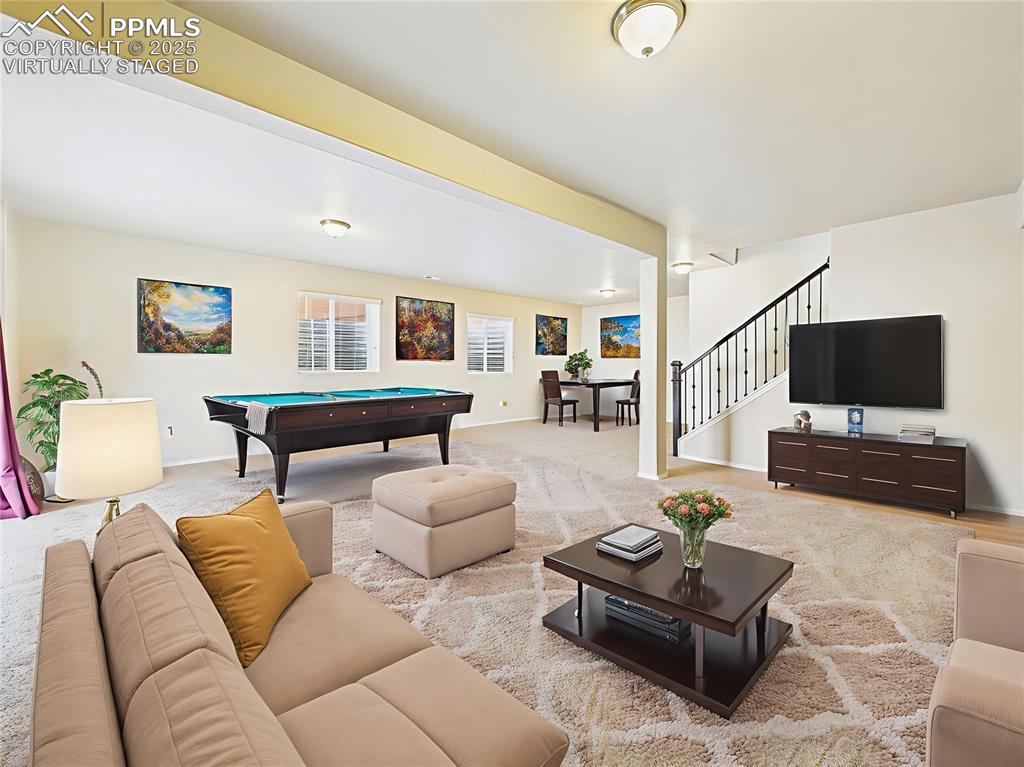 Image 30 of 50: Virtually Staged 2 – Flexible space staged as family room and recreation zo