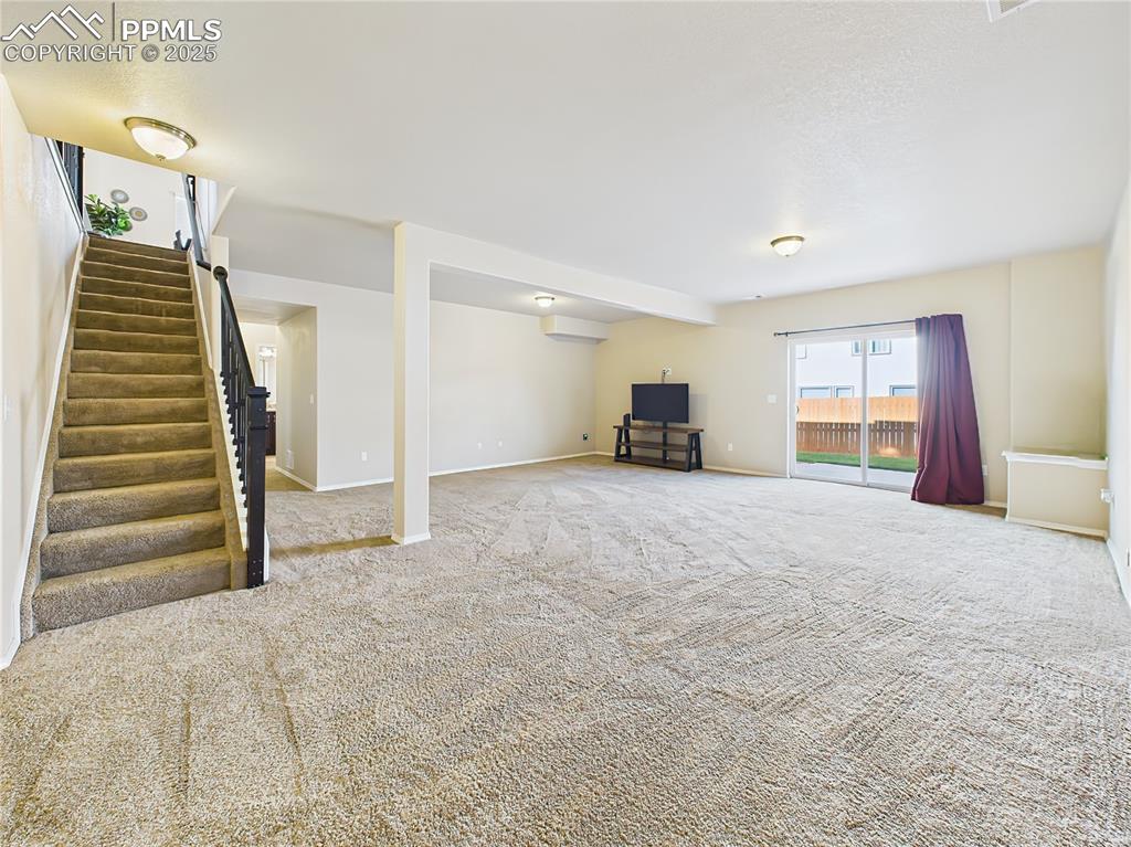 Image 32 of 50: Additional angle featuring walk-out access to the backyard.