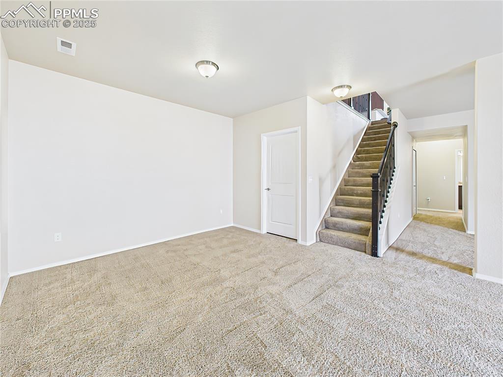 Image 33 of 50: Expansive recreation space with open layout, perfect for entertaining.