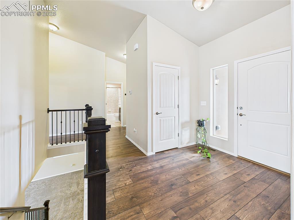 Image 5 of 50: Welcoming entry with tall ceilings, a coat closet, and direct sight-lines t